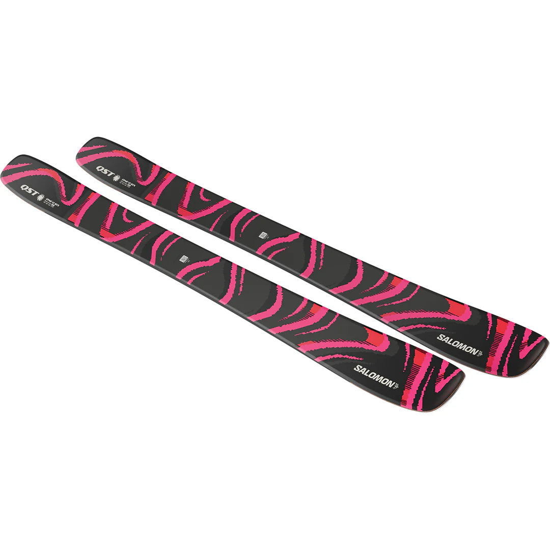 Black and pink QST 106 skis with Salomon branding on a white background