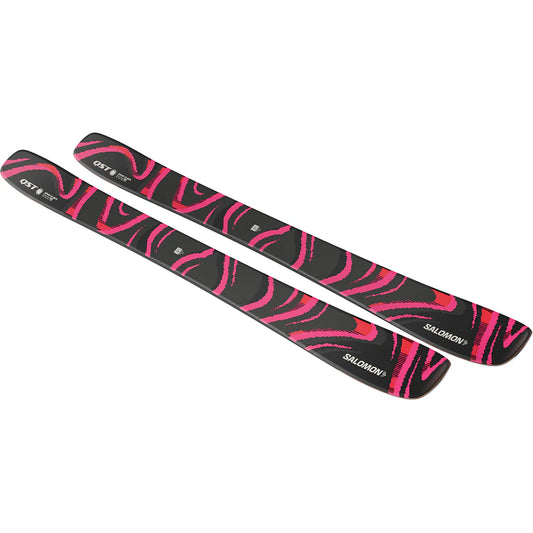 Black and pink QST 106 skis with Salomon branding on a white background
